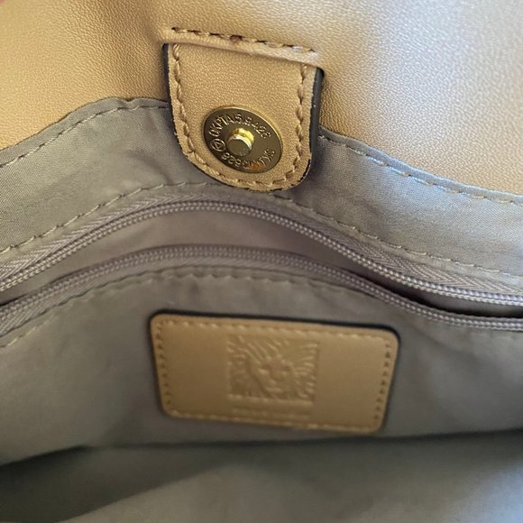 Anne Klein Engraved Lion Logo Gold-Tone Zippered Clutch - Picture 5 of 9